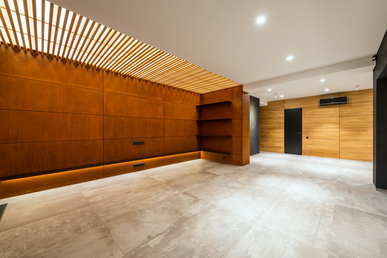 our-services-3 Modern corridor interior with entrance door and air conditioning against wooden shelves above floor in house